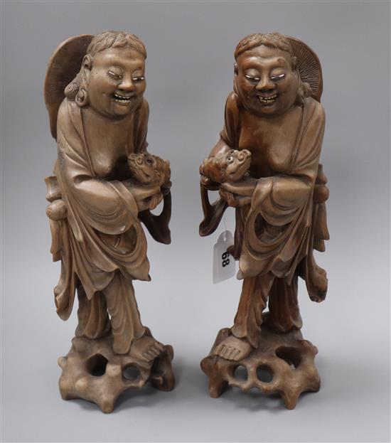 A pair of Chinese carved hardwood figures